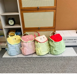 Four fruit-themed kids backpacks showing lemon, strawberry, apple and watermelon designs