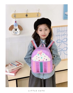 Detailed view of purple cupcake backpack with glitter hearts and rainbow straps for kids