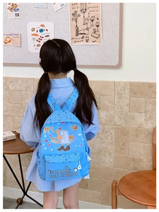 Light blue kids backpack with cartoon camel prints and spacious zipper compartments