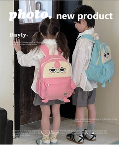 Rear view of kids wearing pink and light blue cartoon backpacks with 3D embroidery
