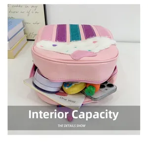 Pink PU leather bag showing internal capacity with phone and cosmetics inside