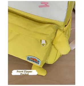 Close-up of kids backpack zipper front pocket with pink H embroidery and logo patch