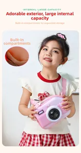 Pink camera-shaped kids shoulder bag showing internal large capacity compartment