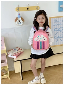 Pink cupcake backpack with rainbow straps and sequin heart detail for little girls