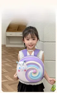 Toddler purple snail backpack with 3D cartoon strawberry details worn by a young girl