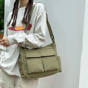 Minimalist military green canvas tote bag with large double front pockets for women