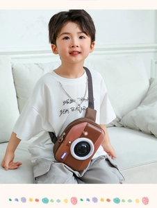 Detail of children's EVA crossbody bag in retro camera shape with adjustable brown strap
