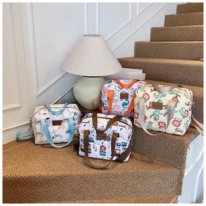 Detail of four cute cartoon animal printed canvas storage bags with handles and straps