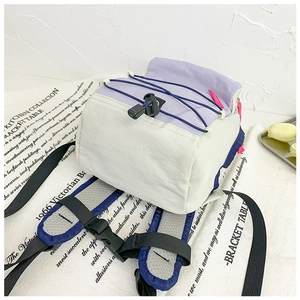 Detail of color-block kids backpack with breathable mesh straps and drawstrings
