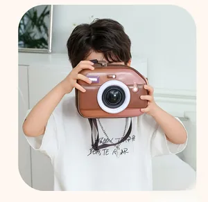 Detail view of brown retro camera-shaped EVA kids shoulder bag with adjustable strap