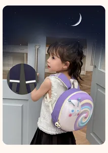 Detail of the child snail backpack featuring white reflective safety strips on purple straps