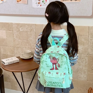 Cute mint green school backpack with teapot monster print for kids in daily use