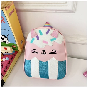 Detail of pink cat cupcake kids backpack with fuzzy top and glittery striped base