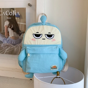 Close-up of sky blue cartoon backpack featuring cute embroidery and 3D plush limbs