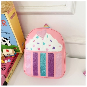 Detail of pink toddler backpack with faux shearling cream top and glitter stripes