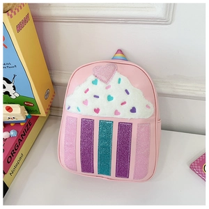 Detail of pink cupcake backpack for kids featuring sequined plush cream and glitter stripes