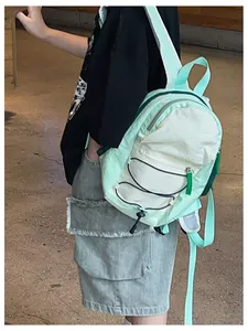 Detail view of the lightweight color-block kids backpack with drawstrings and side zipper