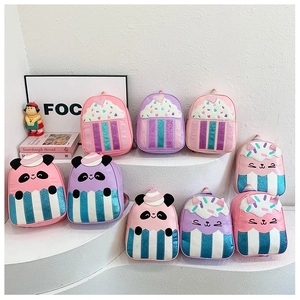 Detail of colorful sequined kids backpacks featuring cartoon panda and unicorn designs