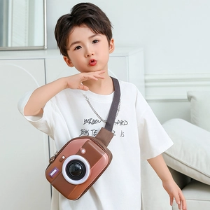 Creative camera-shaped hardshell chest bag for kids with 3D lens and brown fabric strap