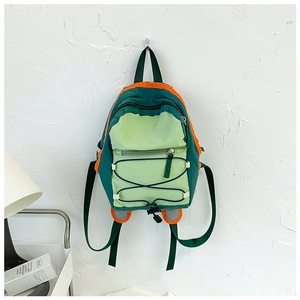Detail of mesh ear design and orange drawstrings on green kids' nylon backpack