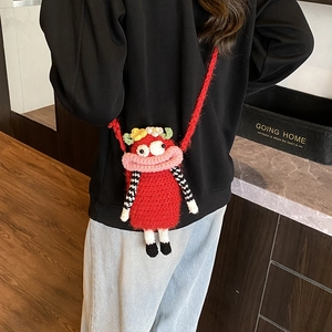 Cute red crochet crossbody bag with cartoon face and floral details for children