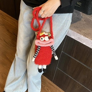 Handmade red crochet monster crossbody bag for kids with funny cartoon eyes and lips