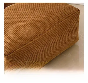 Macro shot of brown corduroy fabric texture and stitching details of the large tote bag