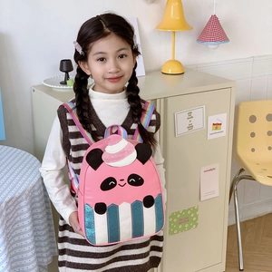 Pink panda cupcake backpack with rainbow straps for kids shown on model in a soft nursery