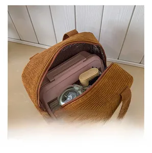 Detail of insulated corduroy lunch bag showing large capacity and silver foil lining
