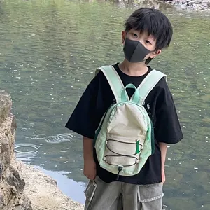 Kids drawcord backpack with green and cream colorblock for outdoor sports and school