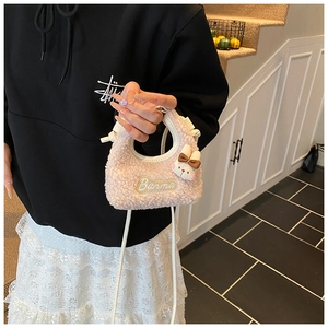 Detail of pink plush crossbody bag for children featuring cute rabbit and Banma embroidery