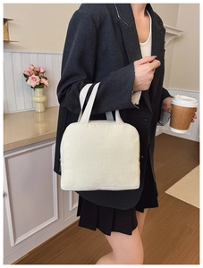Detail of soft off-white corduroy texture on large tote bag with wide handle