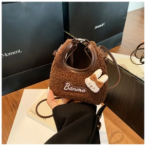 Detail of plush brown rabbit crossbody bag showing soft fleece texture and Banma embroidery