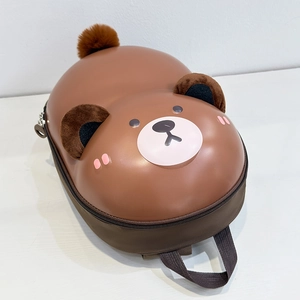 Close-up of the waterproof hard shell and cute plush bear ears on kids backpack