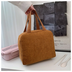Close-up of caramel corduroy lunch bag with sturdy handle and side zipper closure