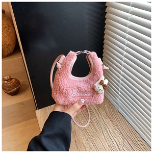 Detail of pink fleece mini bag with plush bunny pendant and Banma embroidery