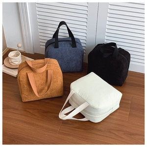 Corduroy tote bags in four colors shown with top handles and secure zipper closures