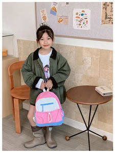 Close-up of lightweight nylon backpack with stylish color blocking for kids