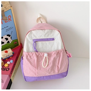 Detail of pink and purple tri-color kids backpack with drawstring front pocket and zippers