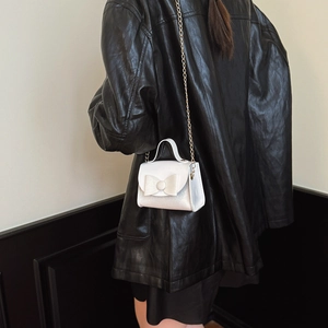 Sparkly white sequin bow handbag for girls featuring a gold chain strap and mini top handle