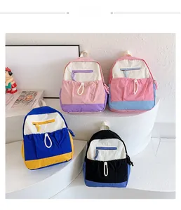 Detailed shot showing four stylish color-block school backpacks for kids on display