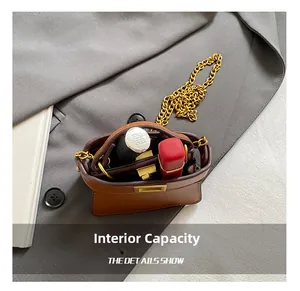 Internal capacity of mini leather bag showing space for lipstick and essentials