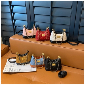 Group display of quilted faux suede bags in six colors with gold chain straps