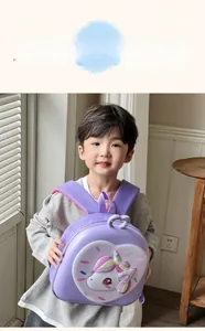 Detail of purple 3D hardshell unicorn backpack showing heart frame and character design