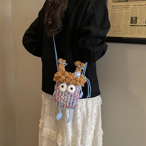 Petit sac en bandoulière monstre en crochet pour enfant avec des yeux mignons
