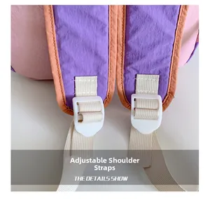 Close-up of adjustable pink and purple shoulder straps with durable buckles for kids backpack