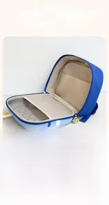 Internal view of blue cartoon ship backpack showing mesh pocket and large compartments