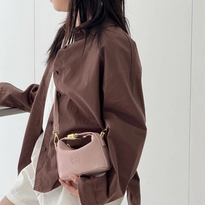 Pink lychee grain leather mini handbag for kids with stylish gold hardware and logo