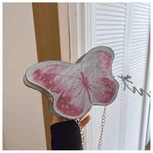 Detailed view of kids butterfly cross body bag with a stylish metal chain strap