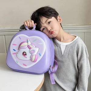 Detail of 3D unicorn hardshell backpack for toddlers shown on a lifestyle setting